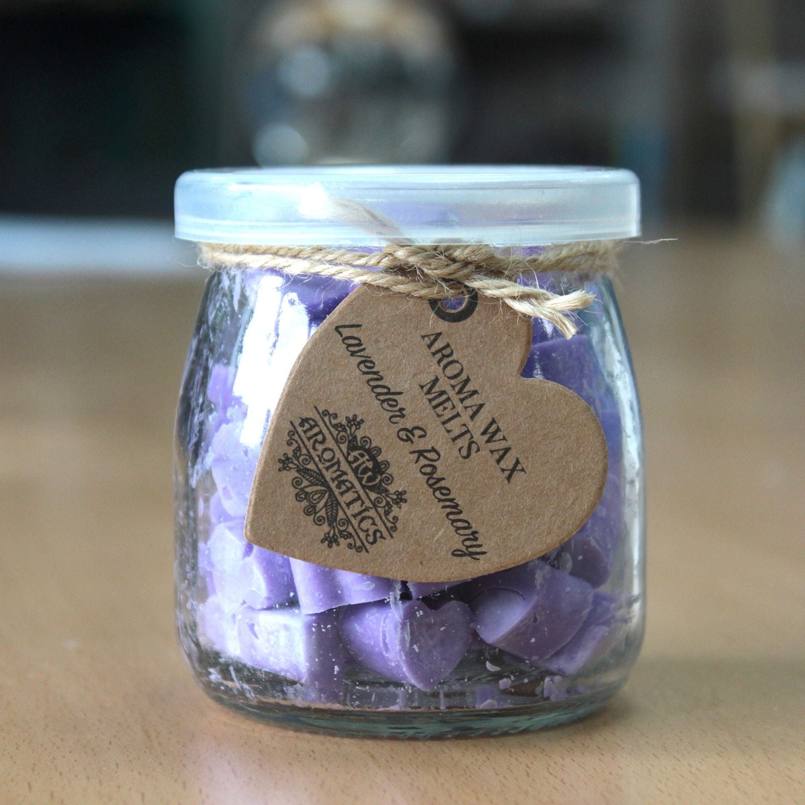 Lavender and rosemary aroma wax melts in glass jar with soy wax hearts