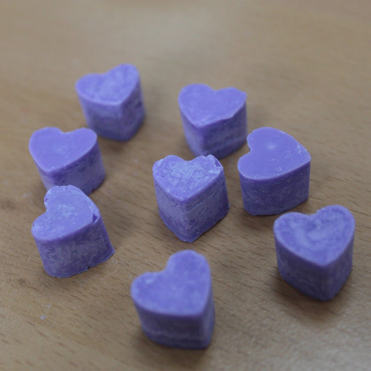 Lavender and rosemary aroma wax melts in glass jar with soy wax hearts