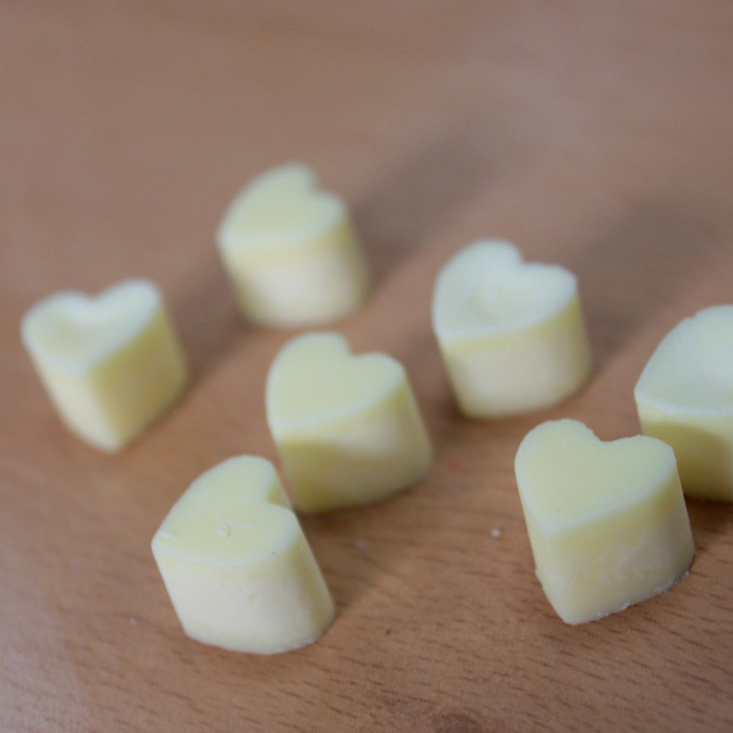 Nutmeg and lemon aroma wax melts in glass jar with soy wax hearts