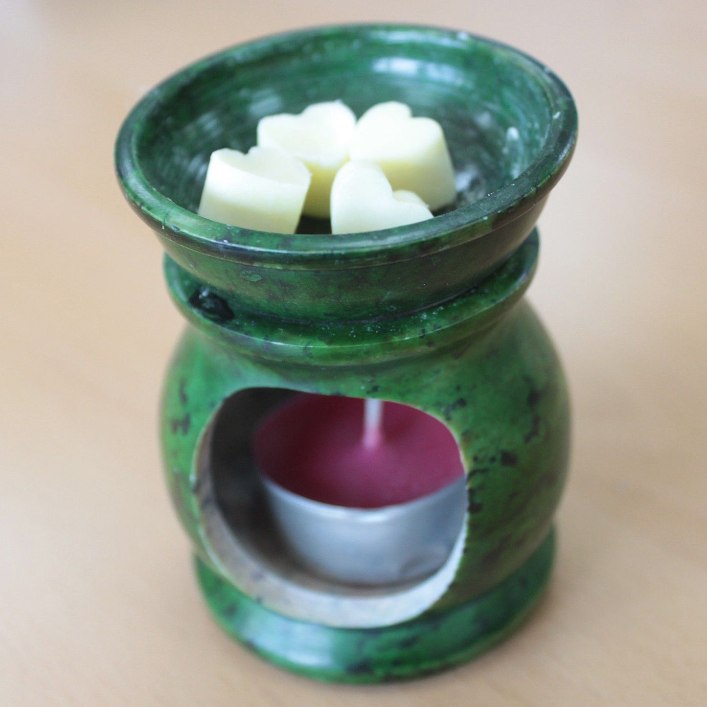 Ylang ylang and orange aroma wax melts in glass jar with soy wax hearts
