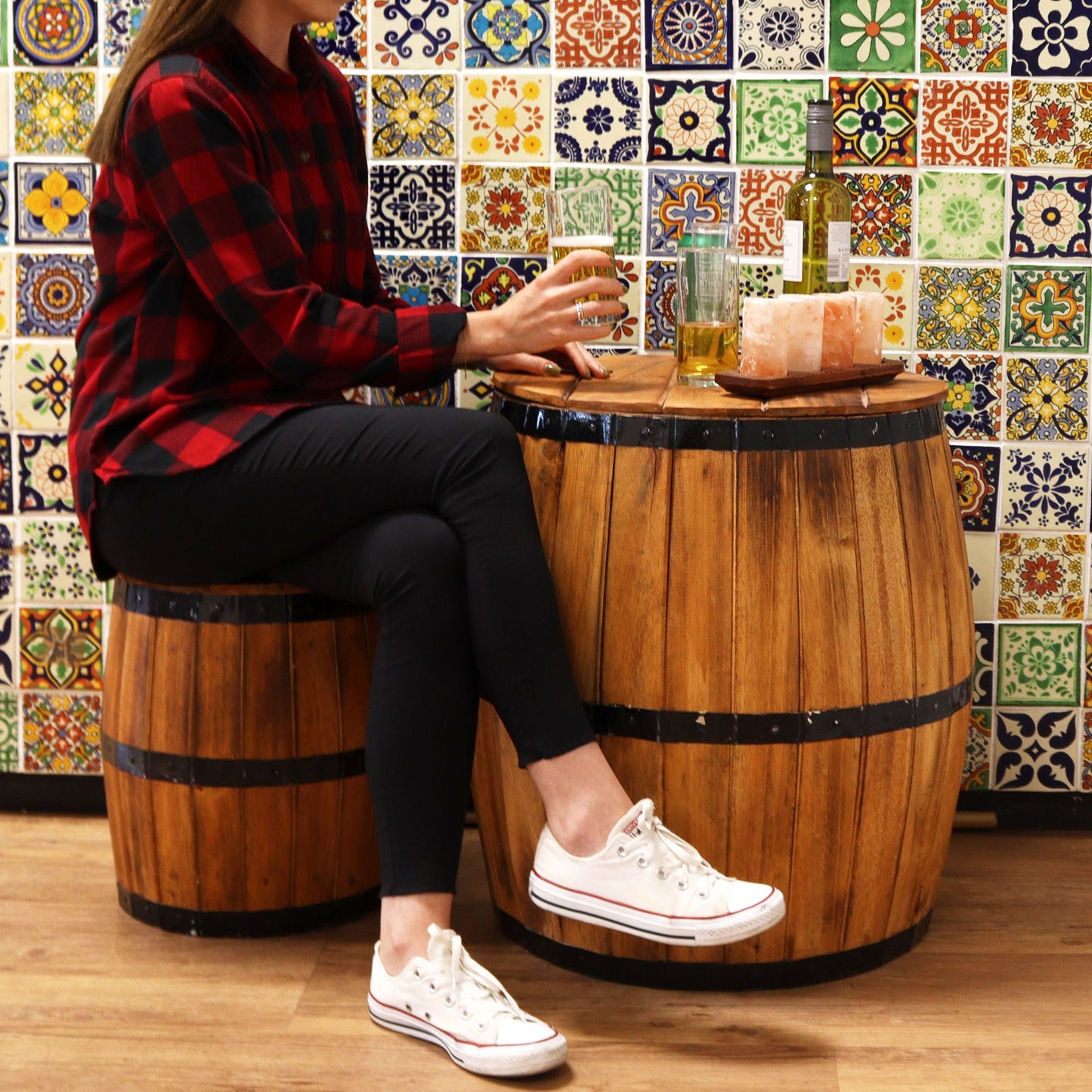 Natural wood beer barrel table with round top and dark metal-style bands
