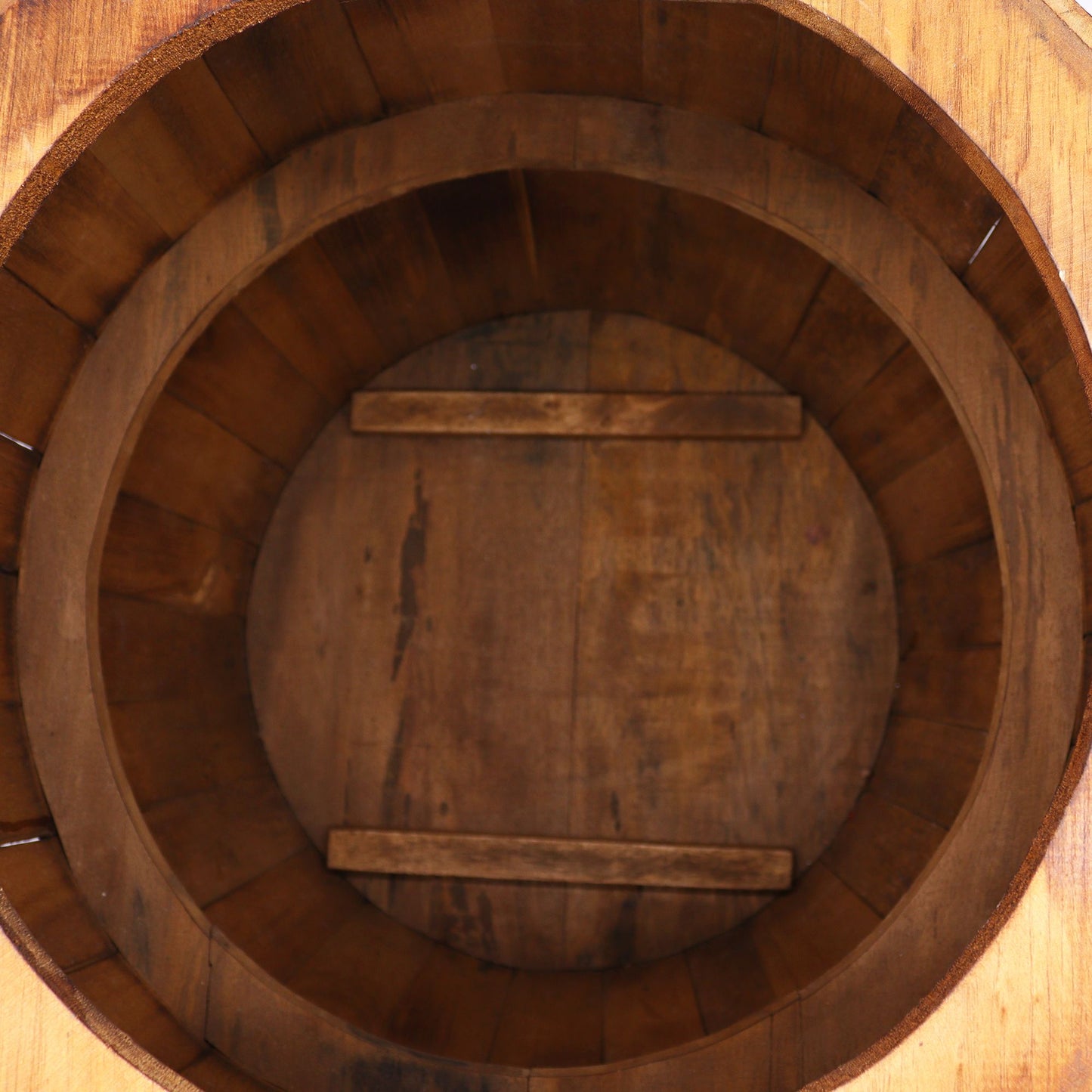 Natural wood beer barrel table with round top and dark metal-style bands