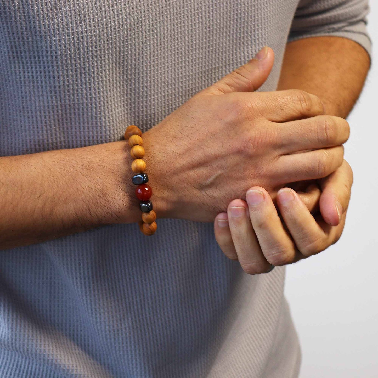 Cedarwood bead bracelet with red jasper gemstone and dark accent beads for Root Chakra design