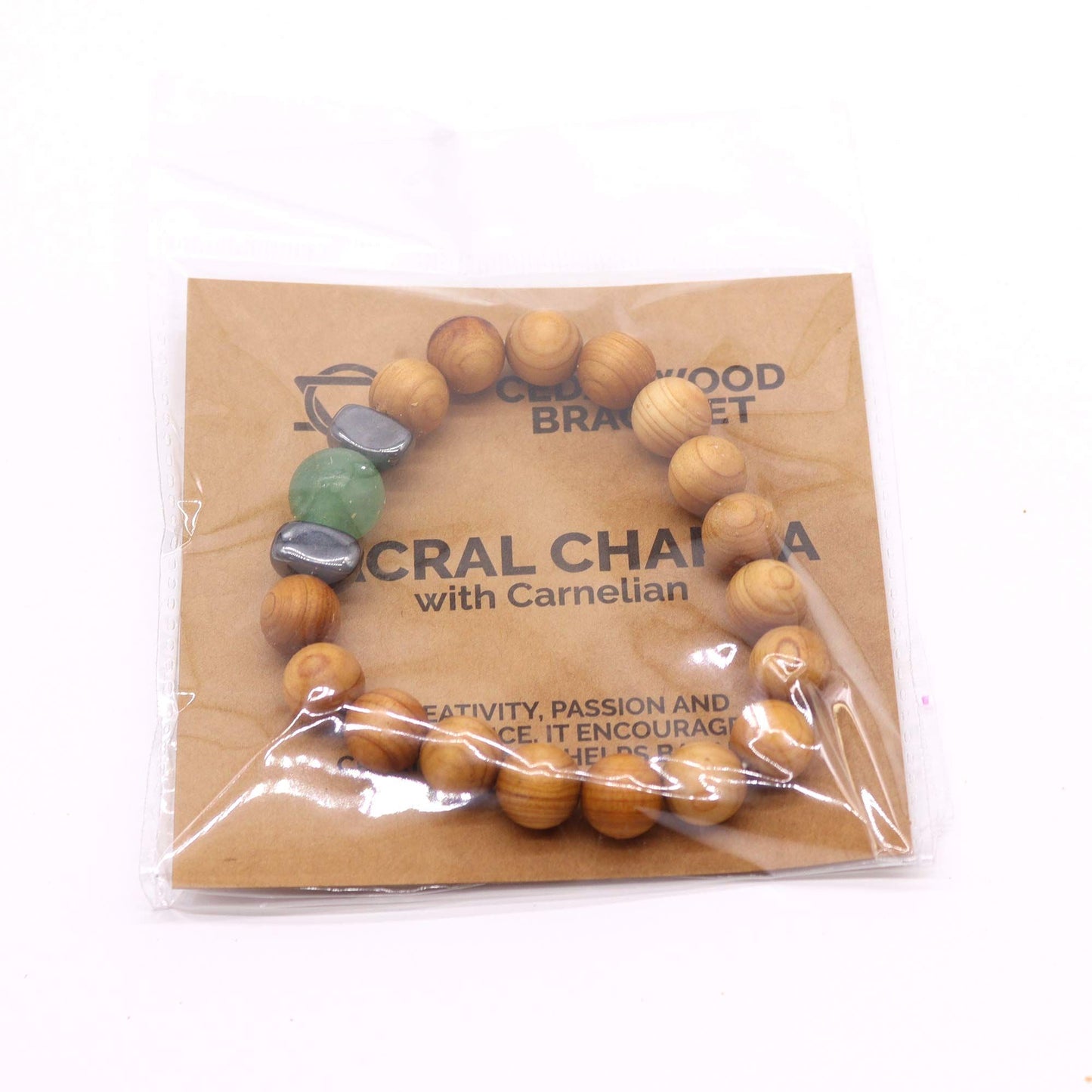 Cedarwood bead bracelet with green aventurin gemstone and dark accent beads for Sacral Chakra design