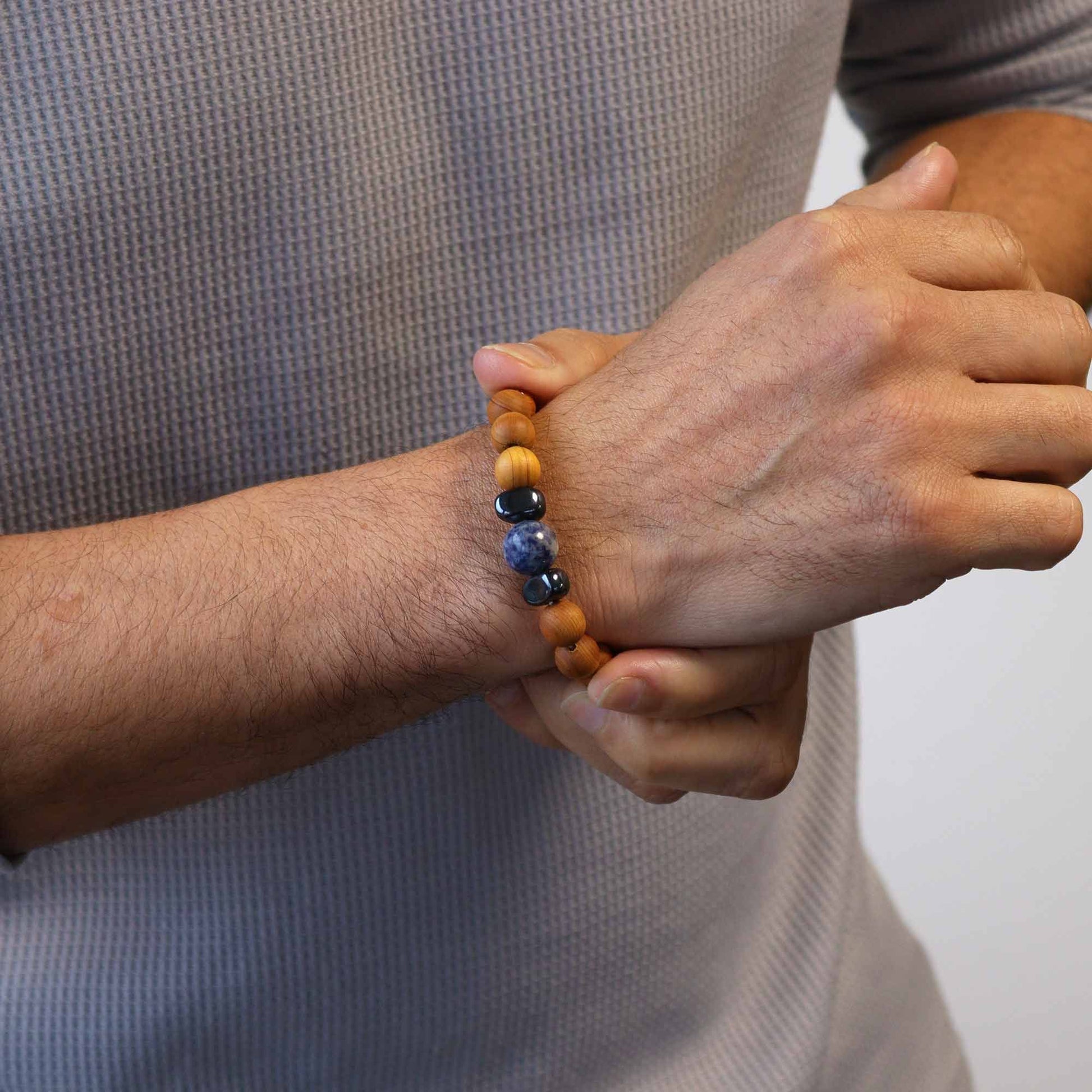 Cedarwood bead bracelet with sodalite gemstone and dark accent beads for Throat Chakra design