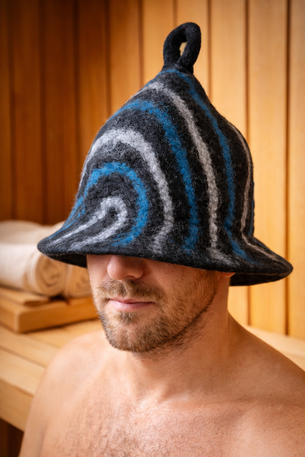 Natural felt sauna hat in black with blue and grey decorative stripes | WoodenLandia