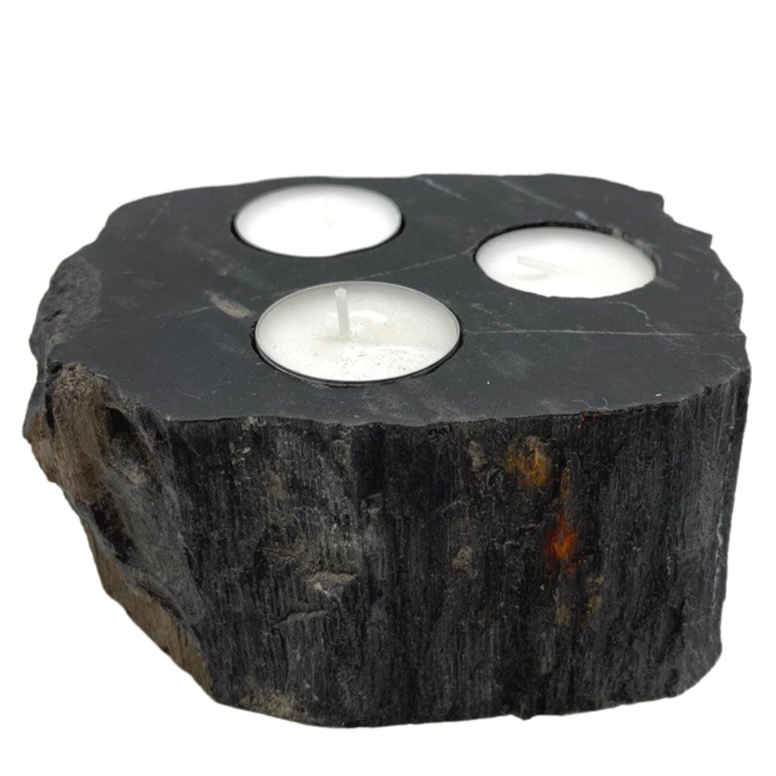 Triple petrified wood candle holder with three tealight candles