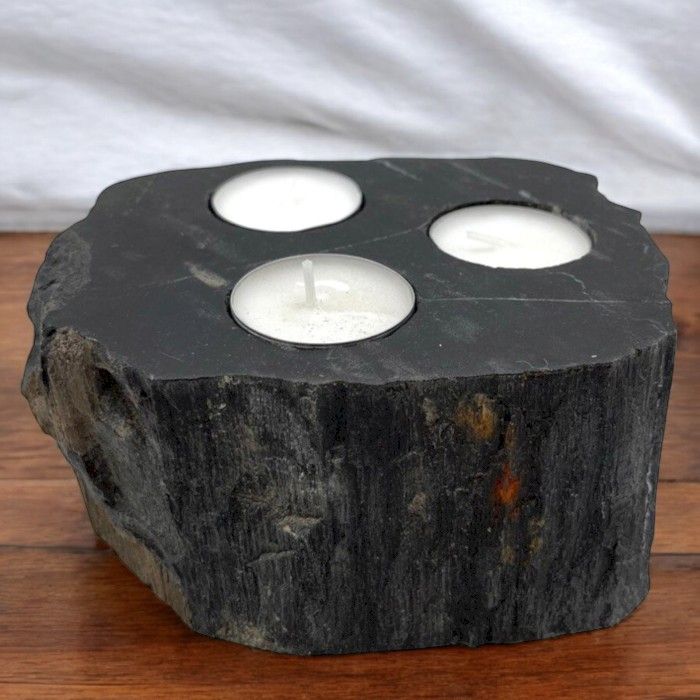 Triple petrified wood candle holder with three tealight candles