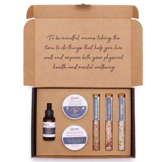 Self-care gift set in an open kraft box with body scrub, bath salts, oil and balm | WoodenLandia