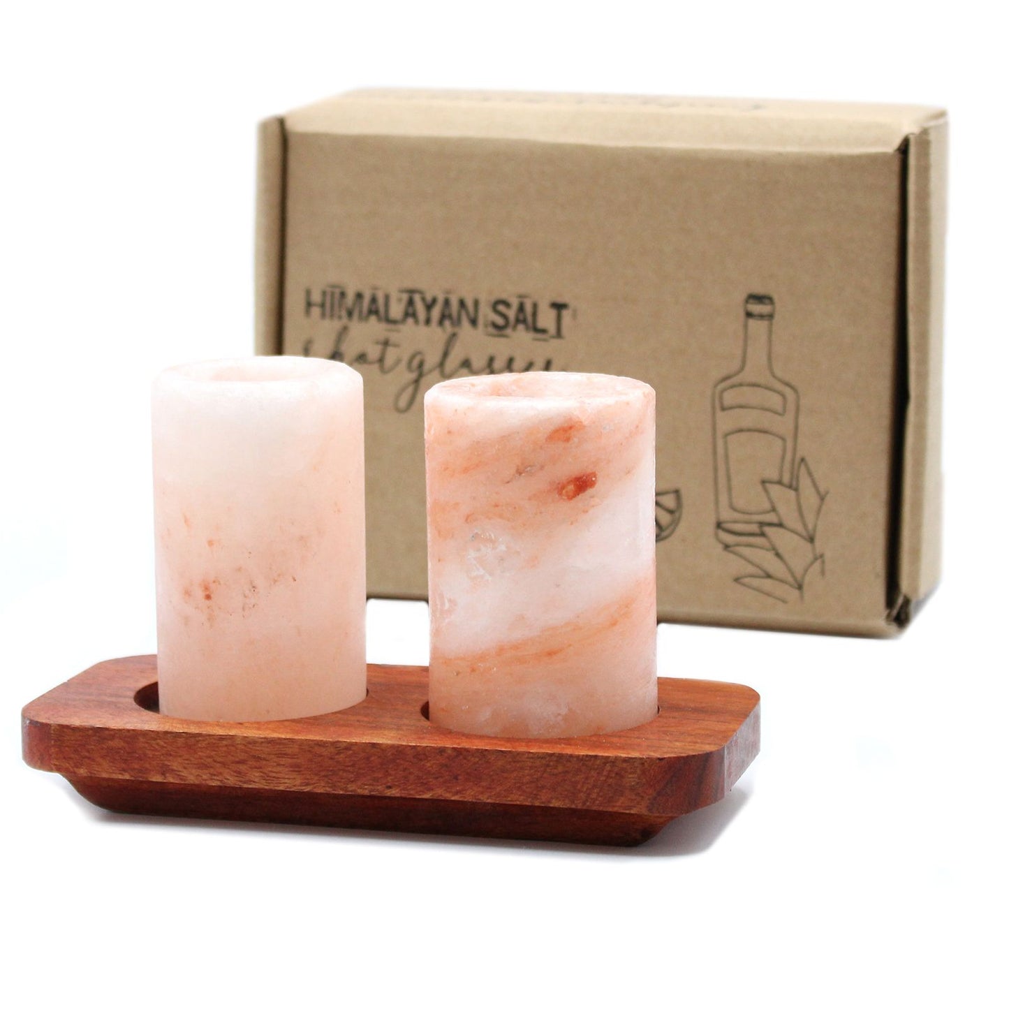 Two Himalayan salt shot glasses on a wooden serving stand with gift box