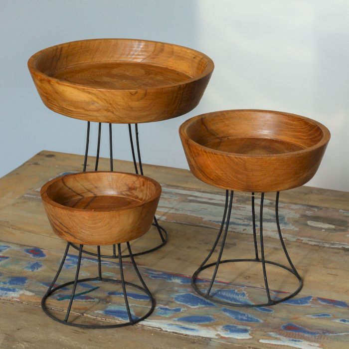 Set of three elevated teak wood bowls on black metal stands | 