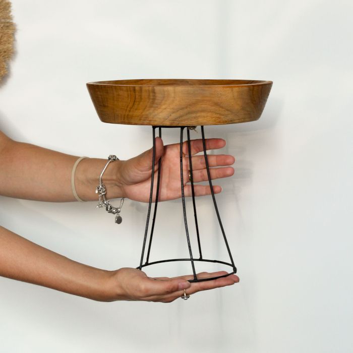 Set of three elevated teak wood bowls on black metal stands | 